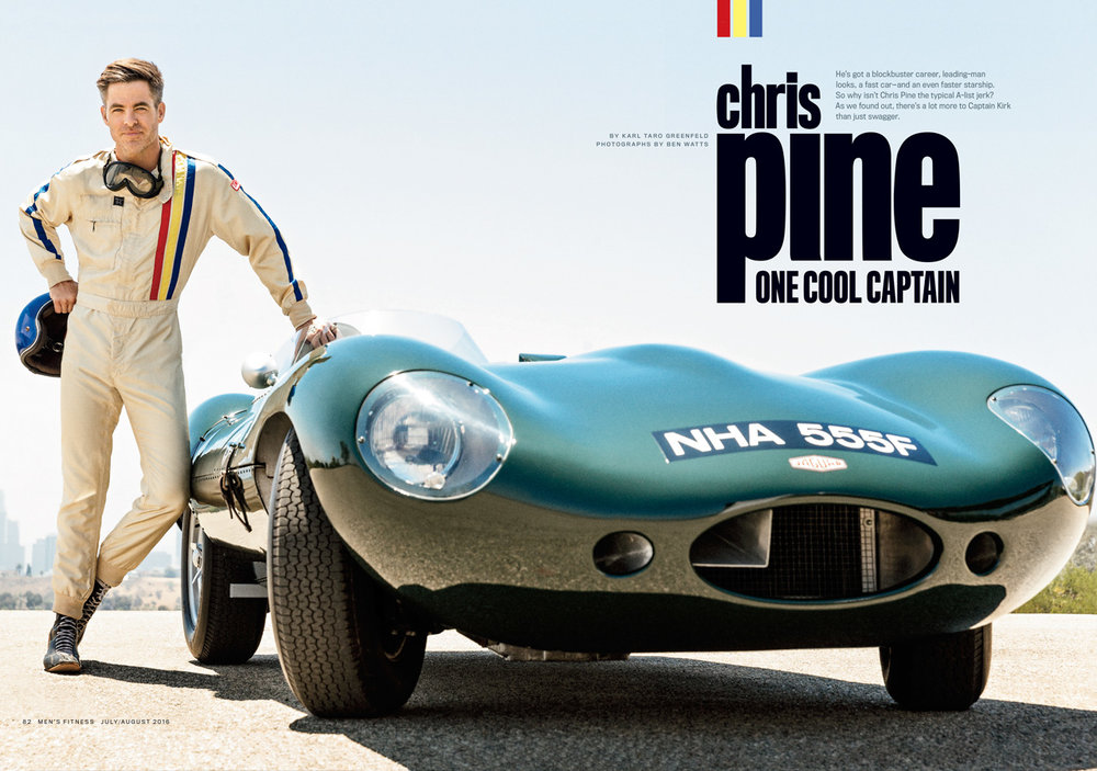 Actor Chris Pine posing with a race car